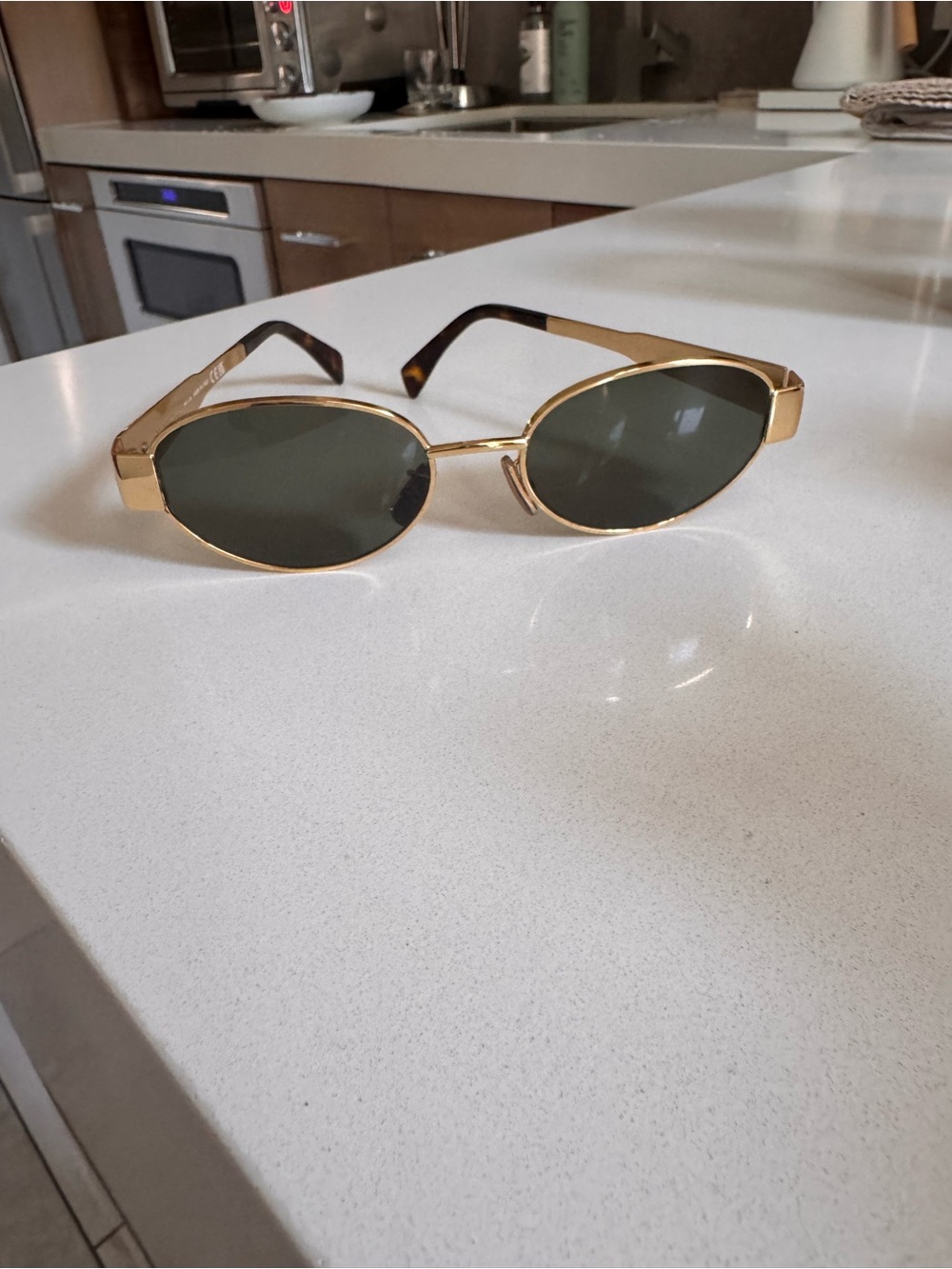 CELINE Triomphe Gold Frame Oval Sunglasses with Dark Green Lenses